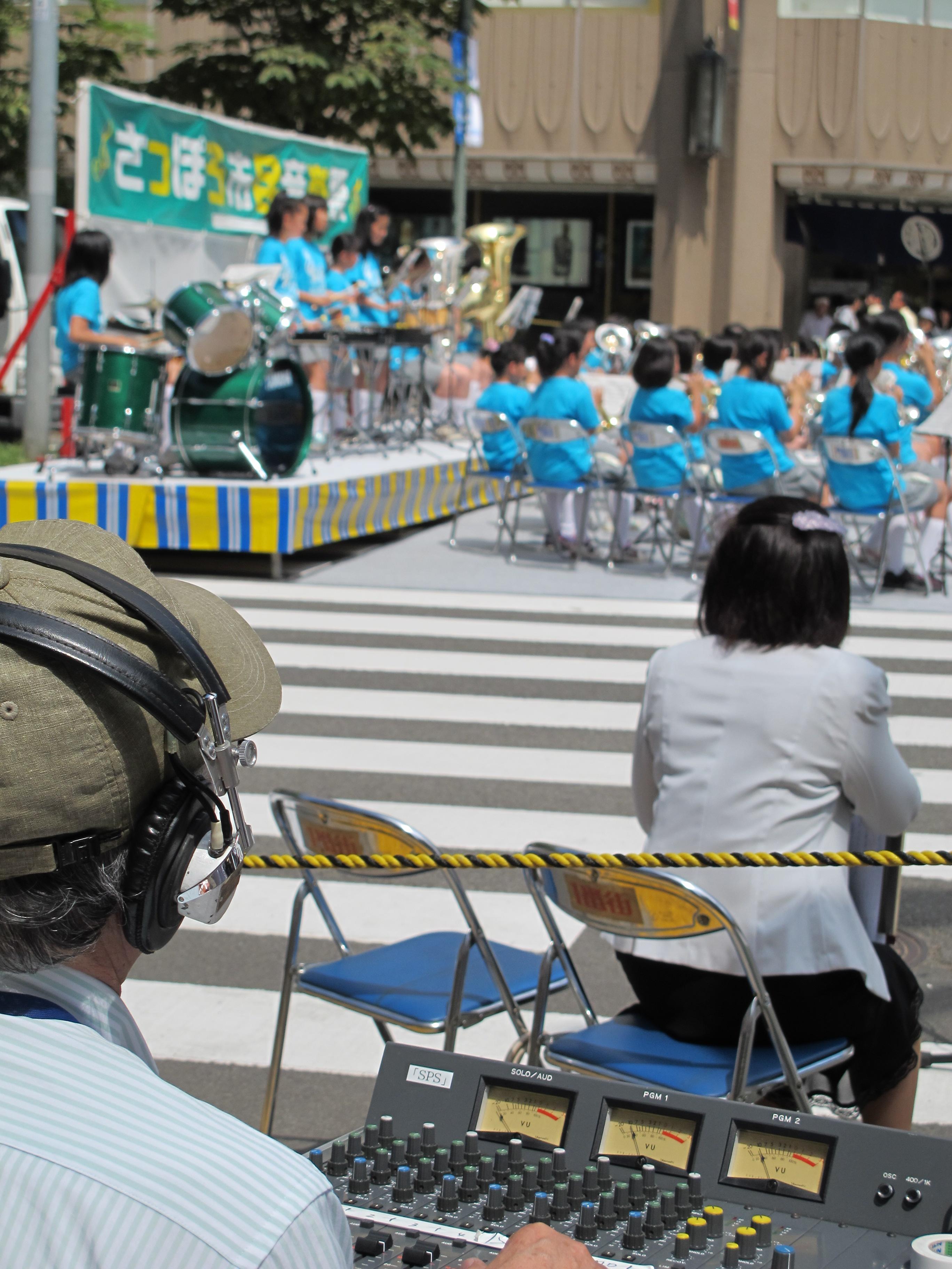 Japanese audio engineer at mixing console.jpg