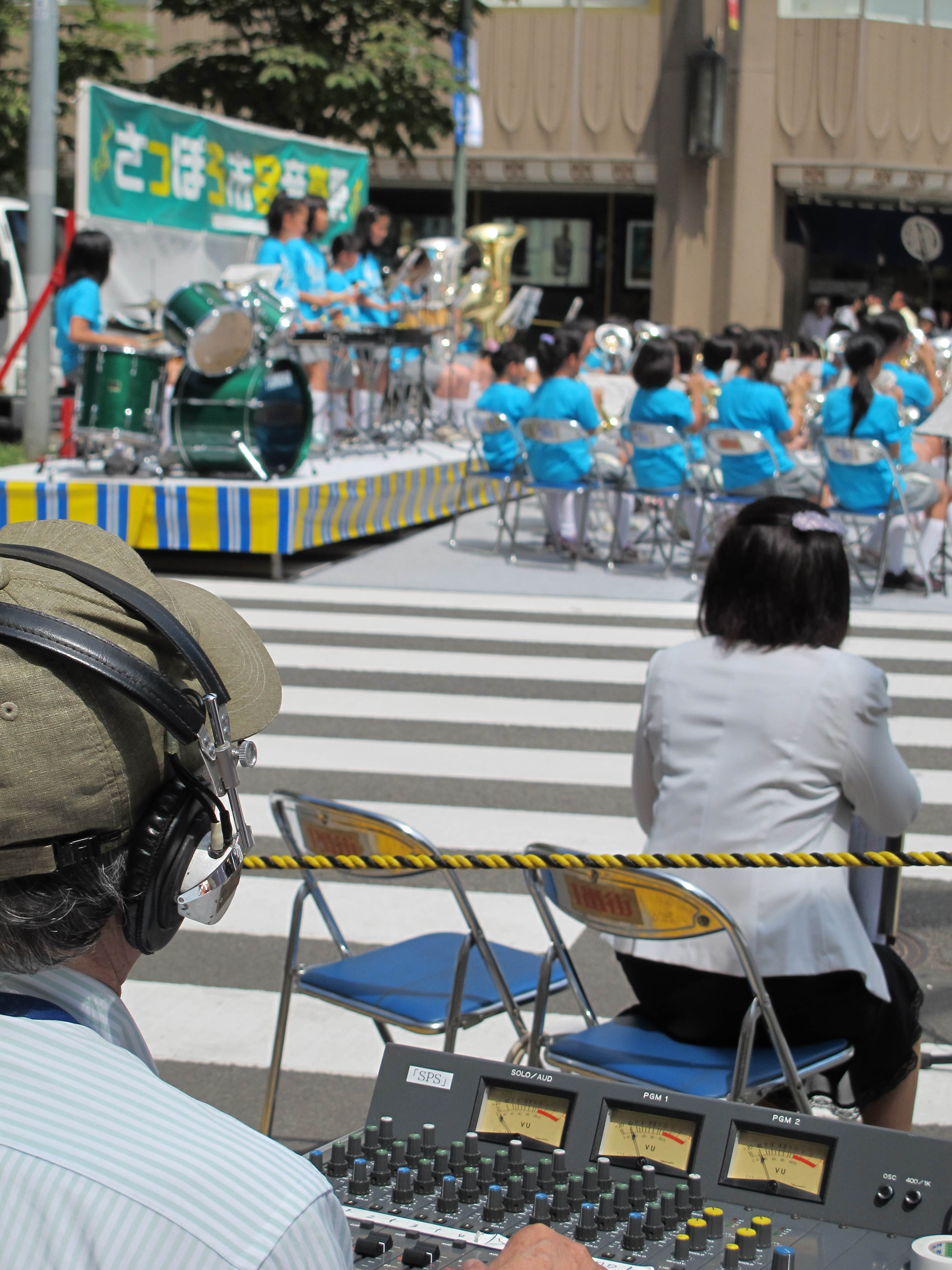 Japanese audio engineer at mixing console.jpg